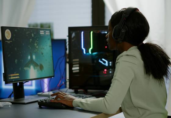 Abstract, modern hero illustration representing African innovation and empowered youth, premium institutional style, soft white and light grey background with gold/amber accents, elegant tech lines and geometric shapes, clean minimal design, ultra high resolution, 16:9 aspect ratio, no text